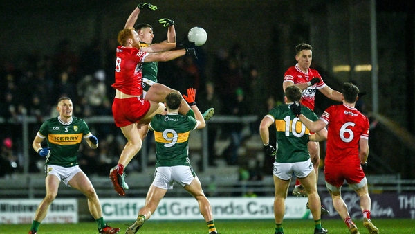 Conor Glass of Derry and Joe O'Connor of Kerry contest a kick-out