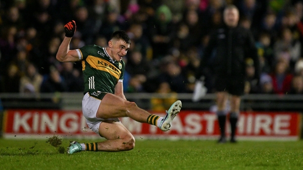 Sean O'Shea slips as he takes a free in the final minutes of the game against Derry