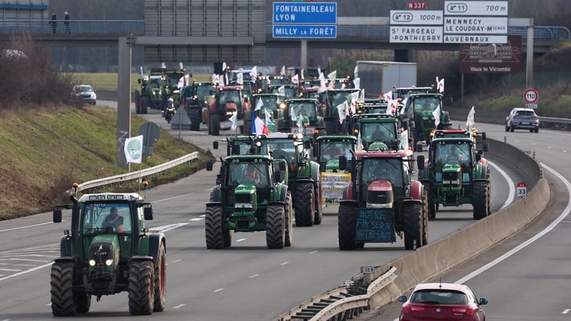 French farmers drive tractors to take part in road block protests on the A6 highway near Ormoy, south of Paris