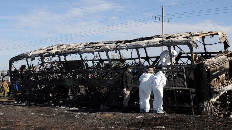 The bus - carrying nearly 50 people - collided head-on with a truck before catching fire
