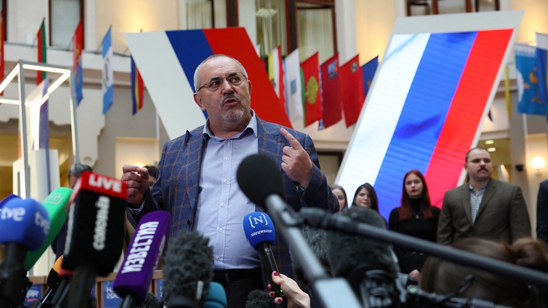 Boris Nadezhdin talks to the media as he submits signatures collected in support of his candidacy at the CEC in Moscow