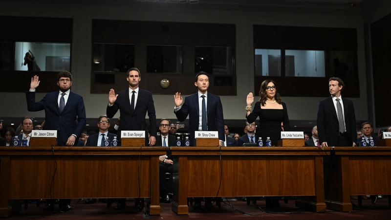 (L-R) Jason Citron, CEO of Discord, Evan Spiegel, CEO of Snap, Shou Zi Chew, CEO of TikTok, Linda Yaccarino, CEO of X, and Mark Zuckerberg, CEO of Meta, are sworn in before testifying