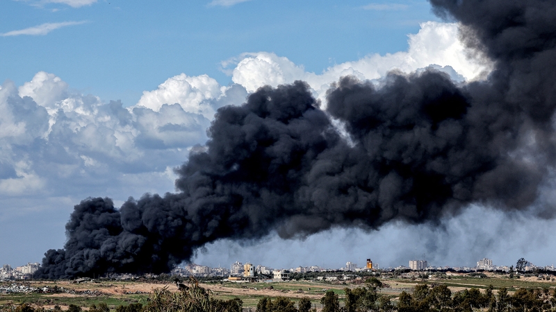 A dark smoke plume rises from Gaza earlier today