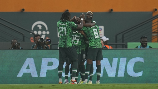 Nigeria players celebrate Ademola Lookman's winner against Angola