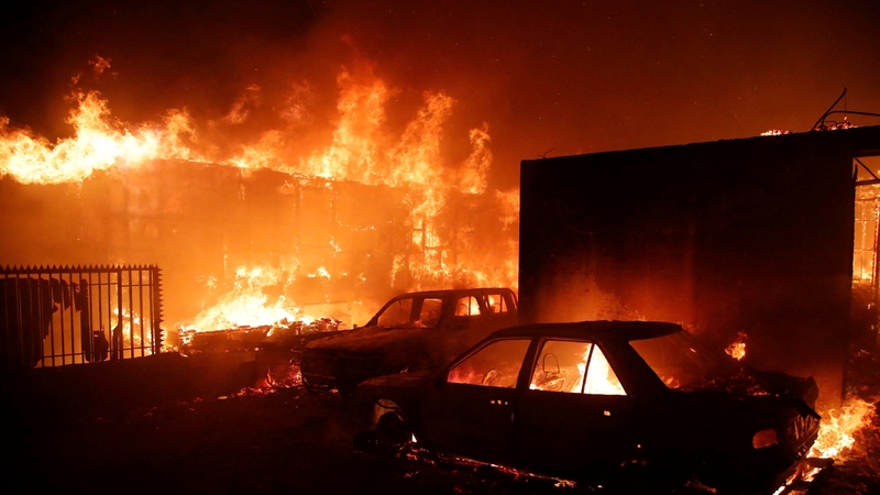 Vehicles and homes burned during a fire in Viña del Mar, Chile
