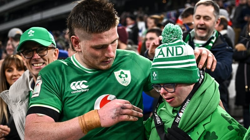 Joe McCarthy gives his Player of the Match award to his brother Andrew after full-time