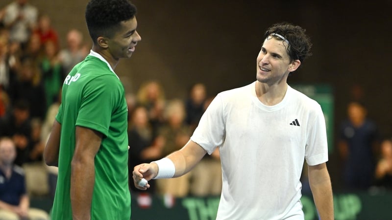 Dominic Thiem of Austria embraces Ireland's Michael Agwi after their match