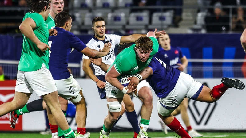 Bryn Ward of Ireland is tackled by Barnabé Massa