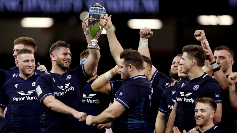 Scotland players lift the Doddie Weir Cup after their one-point win