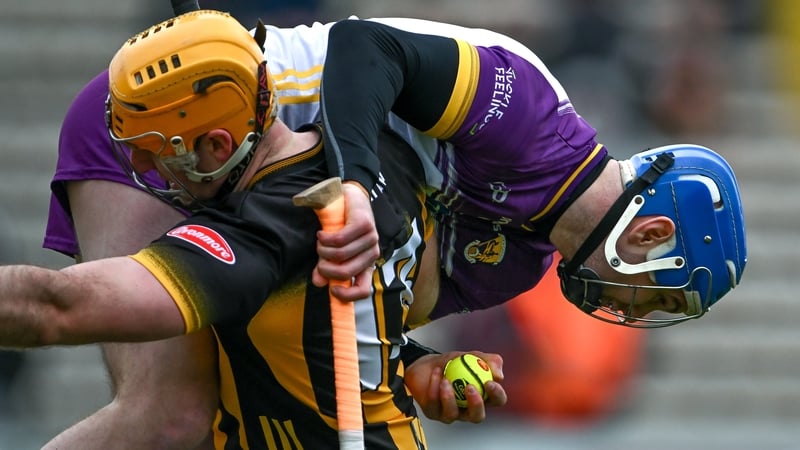 Wexford goalkeeper Mark Fanning hitches a lift from Kilkenny's Billy Ryan