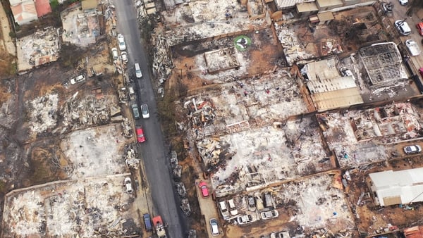 Aerial view of burned homes and vehicles after a forest fire in Quilpue, Viña del Mar, Chile