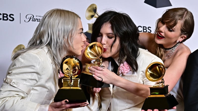 Taylor Swift (R) winner of Best Pop Vocal Album and Album of the Year for Midnights poses with US indie group Boygenius