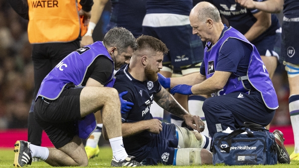 Scotland's Luke Crosbie receives treatment during the clash against Wales