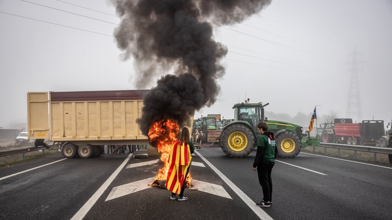 Farmers block the A2 Highway with their tractors during a protest in Fondarella, Spain