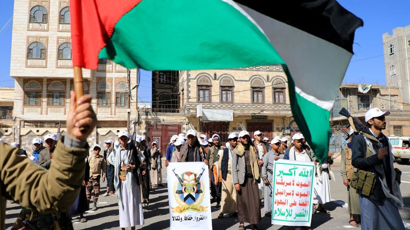 Houthi fighters rally in support of Palestinians and recent strikes on shipping in the Red Sea