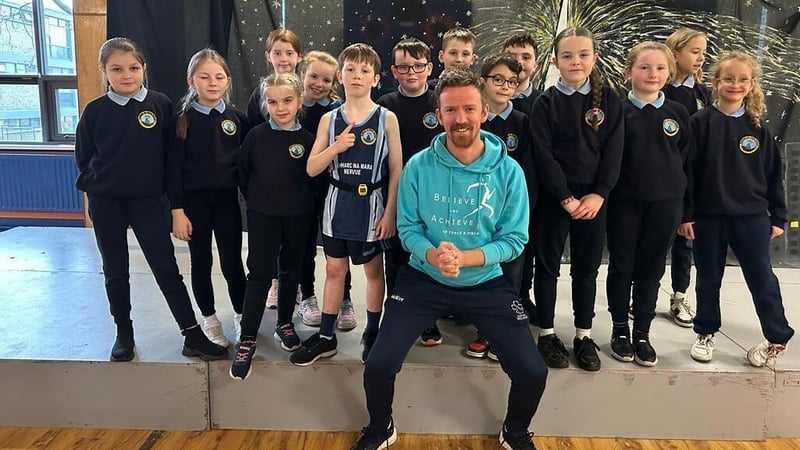 Charlie Sweeney with his classmates and coach Dermot McDermott