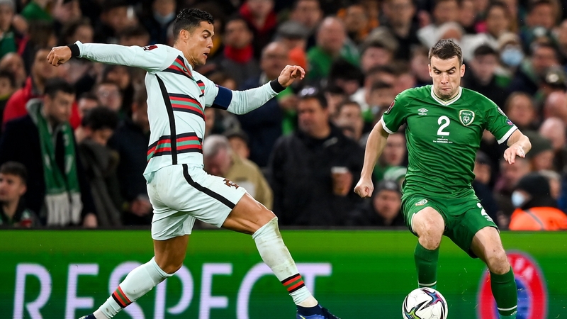 Seamus Coleman and Cristiano Ronaldo in action during the qualifiers for the 2022 World Cup