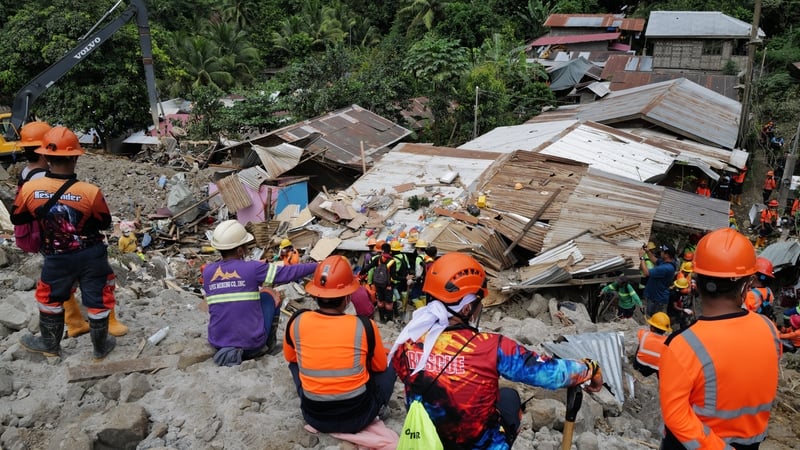 The landslide struck on Tuesday night, destroying houses and engulfing three buses and a jeepney waiting to pick up workers from a gold mine