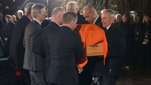 Richard Bruton, far right, carries the coffin of his brother former taoiseach John Bruton