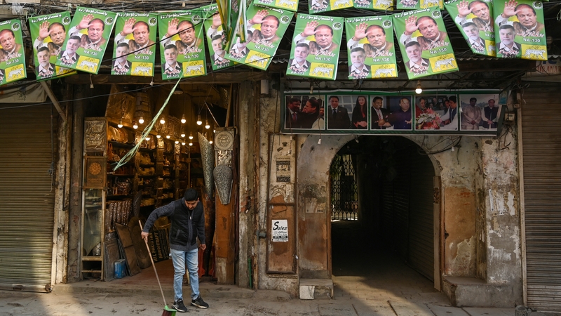 Posters of Nawaz Sharif above a shop in Lahore