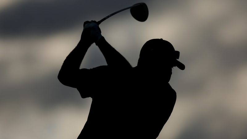 Kevin Stadler plays a shot shortly before play was suspended at the Phoenix Open due to darkness