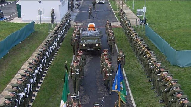 A view of the coffin on its way into Rosske cemetery ahead of the burial