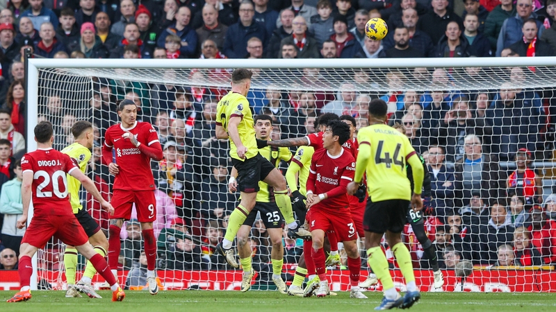 Dara O'Shea rises to head home Burnley's equaliser at Anfield