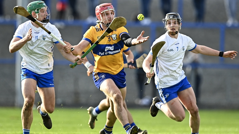 Jack Prendergast and PJ Fanning pursue Clare's John Conlon
