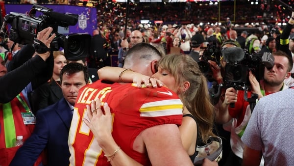 Travis Kelce of the Kansas City Chiefs hugs Taylor Swift after victory over the San Francisco 49ers, his third Super Bowl