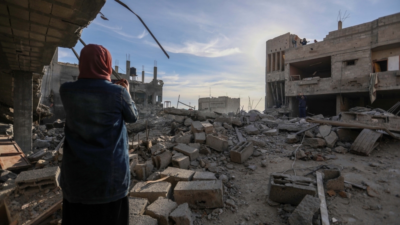 People inspect the damage to their homes following Israeli air strikes on Rafah