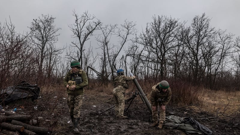 Ukrainian soldiers preparing to fire a mortar at Russian forces in the eastern Donetsk region