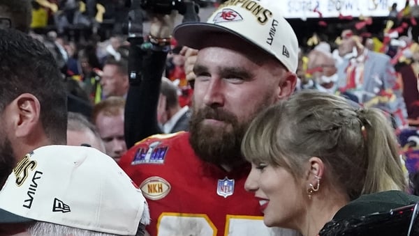 Kansas City Chiefs' tight end Travis Kelce and Taylor Swift embrace as they celebrate the Chiefs winning Super Bowl LVIII against the San Francisco 49ers at Allegiant Stadium in Las Vegas, Nevada, February 11, 2024. (Photo by TIMOTHY A. CLARY/AFP)