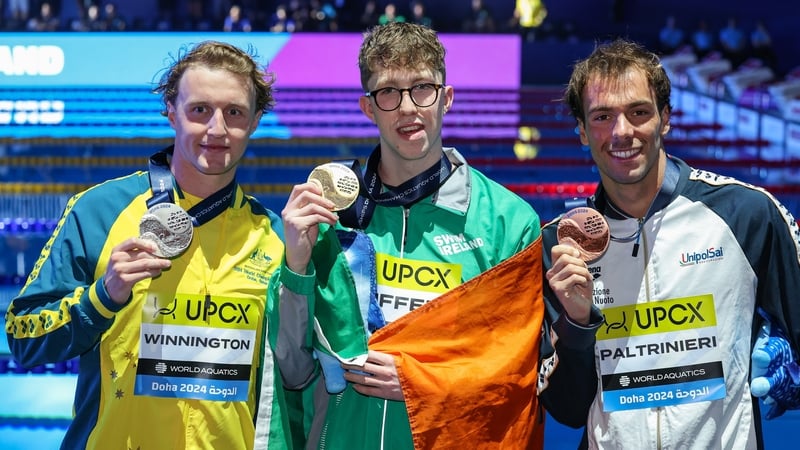 Daniel Wiffen is flanked by Australia's Elijah Winnington and Italy's Gregorio Paltrinieri at the Aspire Dome in Doha