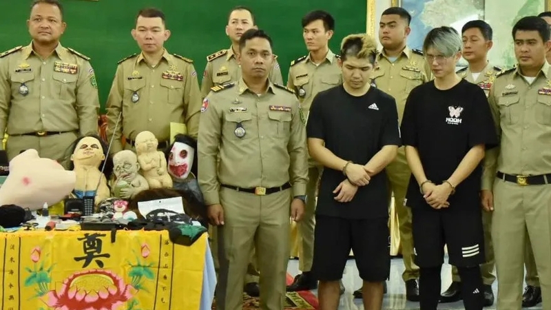 The men were paraded for the media along with items recovered from their room (Pic: Cambodian National Police)