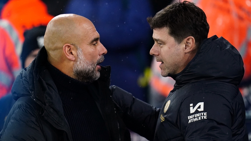 Manchester City manager Pep Guardiola (L) and Chelsea boss Mauricio Pochettino
