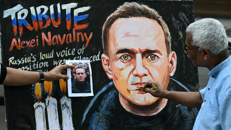 Prithviraj Kambli puts final touches to a painting of late Russian opposition leader in Mumbai