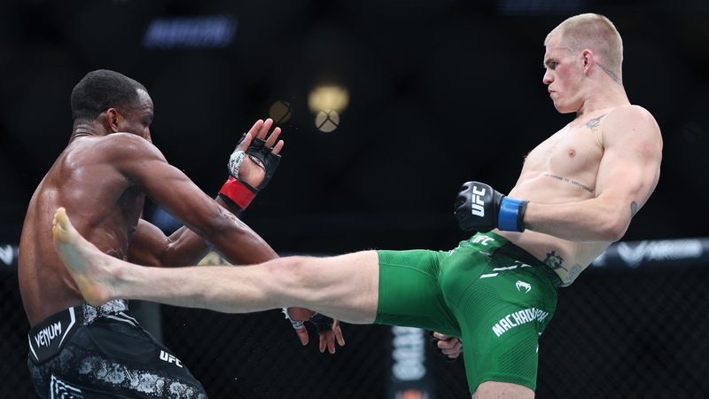Ian Garry (R) kicks Geoff Neal in their welterweight fight at the Honda Center in California