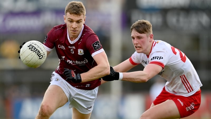Dylan McHugh of Galway skips past Tyrone's Lorcan McGarrity