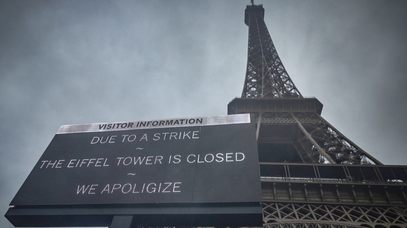 A board informs visitors that the Eiffel Tower is closed as staff go on strike