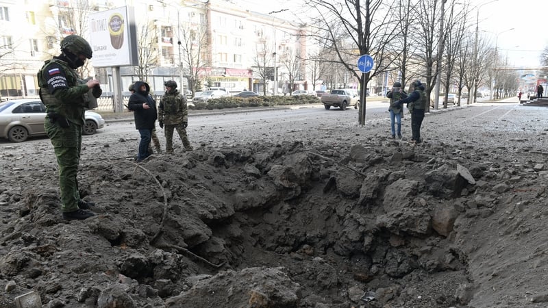 A military investigator inspects damage at the scene of recent shelling in Donetsk, Russian-controlled Ukraine