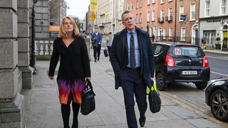 FAI chief executive Jonathan Hill, right, and FAI independent director Catherine Guy arriving at Leinster House