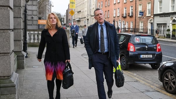 FAI chief executive Jonathan Hill, right, and FAI independent director Catherine Guy arriving at Leinster House