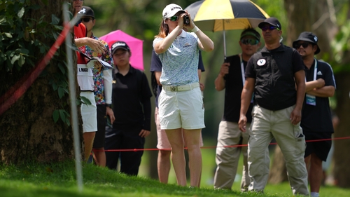 Leona Maguire uses a range finder before her second shot on the seventh