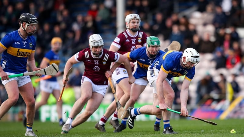 Tipp's Seamus Kennedy (far right) looks to fashion some space