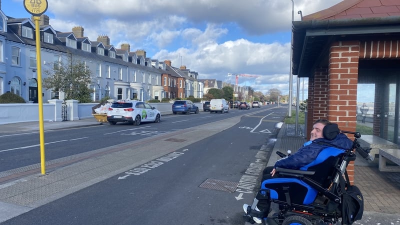 Wheelchair user Alan Fay pictured waiting for a bus
