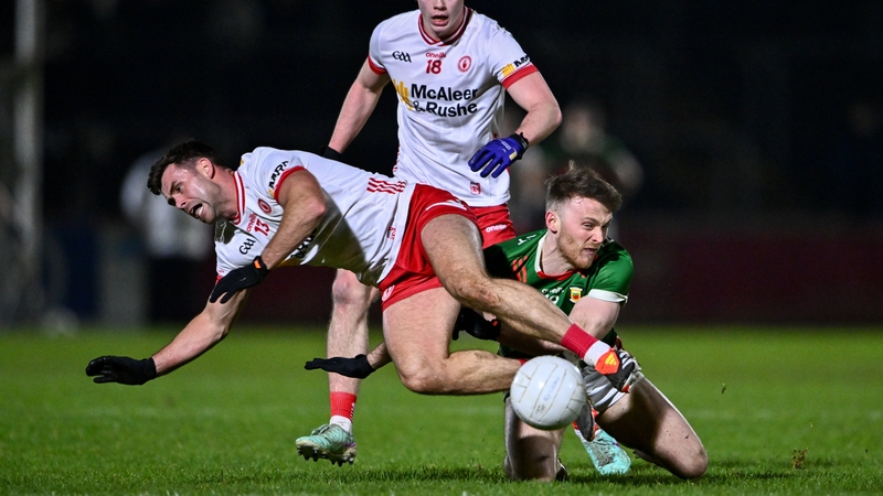 Darren McCurry challenges Darren McHale for possession