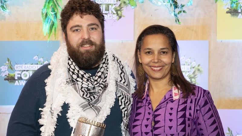 Best Folk Singer Eoghan Ó Ceannabháin (L), whose award was presented by Rhiannon Giddens (R)
