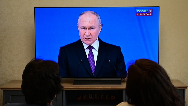 People watch in Moscow as Vladimir Putin made his annual national address to parliament and other members of the country's elite