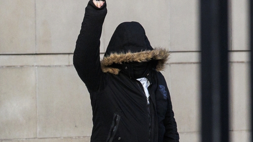James Smyth gestures as he leaves Belfast Crown Court after the verdict