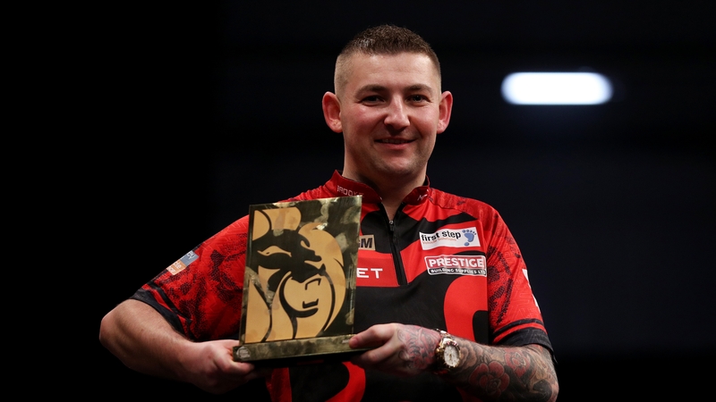Nathan Aspinall with his trophy after defeating Rob Cross in the final